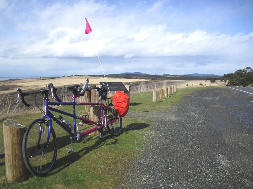 Rich's Pink and Blue tandem with a view of far mountains and the sky