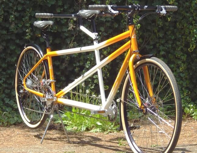 Orange and White Rodriguez custom tandem bike with disc brakes and 700c wheels