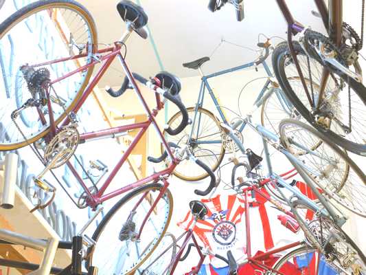A look up at 5 of the bikes in the museum