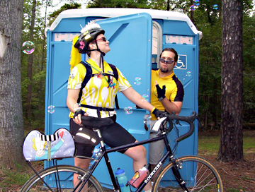 Karen with her bike outside a porta potty